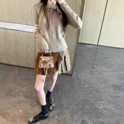 TB女士秋冬季新款针织毛衣羊毛呢格子拼接百褶裙可拆卸蝴蝶结毛衣 1件图4